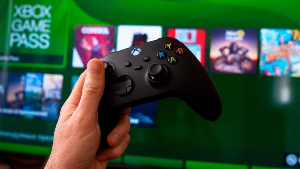 Person holding xbox control